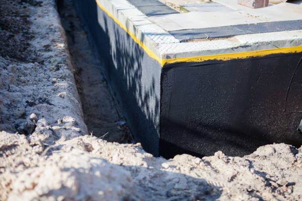 Professional Basement Waterproofing technician working in Jefferson, NC